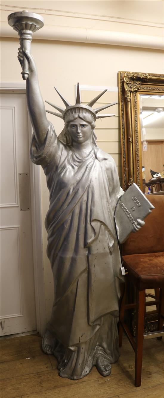 A large cast metal figure, Statue of Liberty